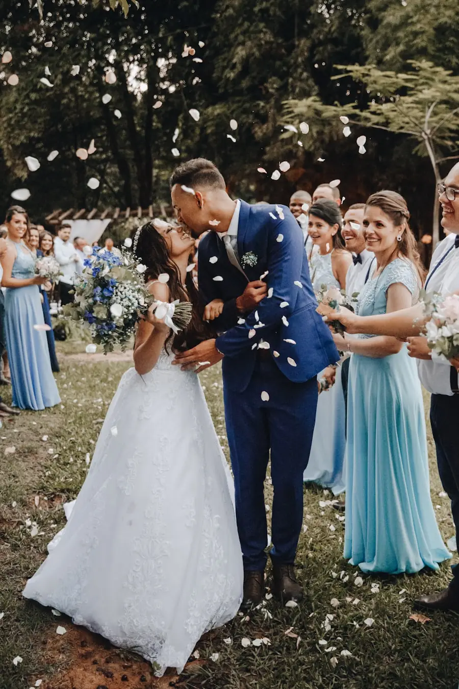 Newlyweds celebrating with flower petals after their ceremony